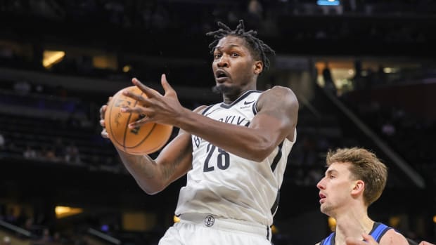 Brooklyn Nets forward Dorian Finney-Smith (28) grabs a rebound 